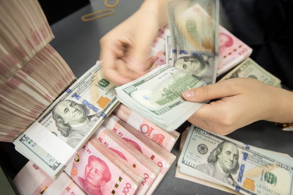 Đồng USD và đồng Nhân dân tệ trong thanh toán quốc tế