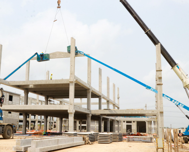A crane lifting a buildingAI-generated content may be incorrect.